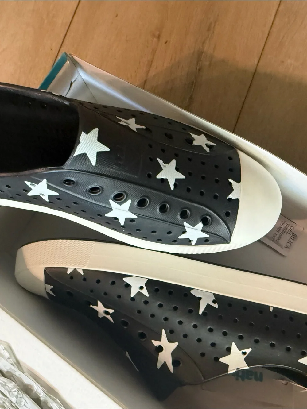 Native Adult Shoes Jefferson Slip-On in Black with White Stars